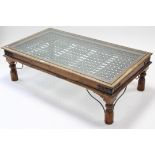 An eastern-style iron-bound hardwood low rectangular coffee table on short turned legs & inset