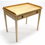 A pine tray-top side table fitted frieze drawer, & on square tapered legs, 36” wide.