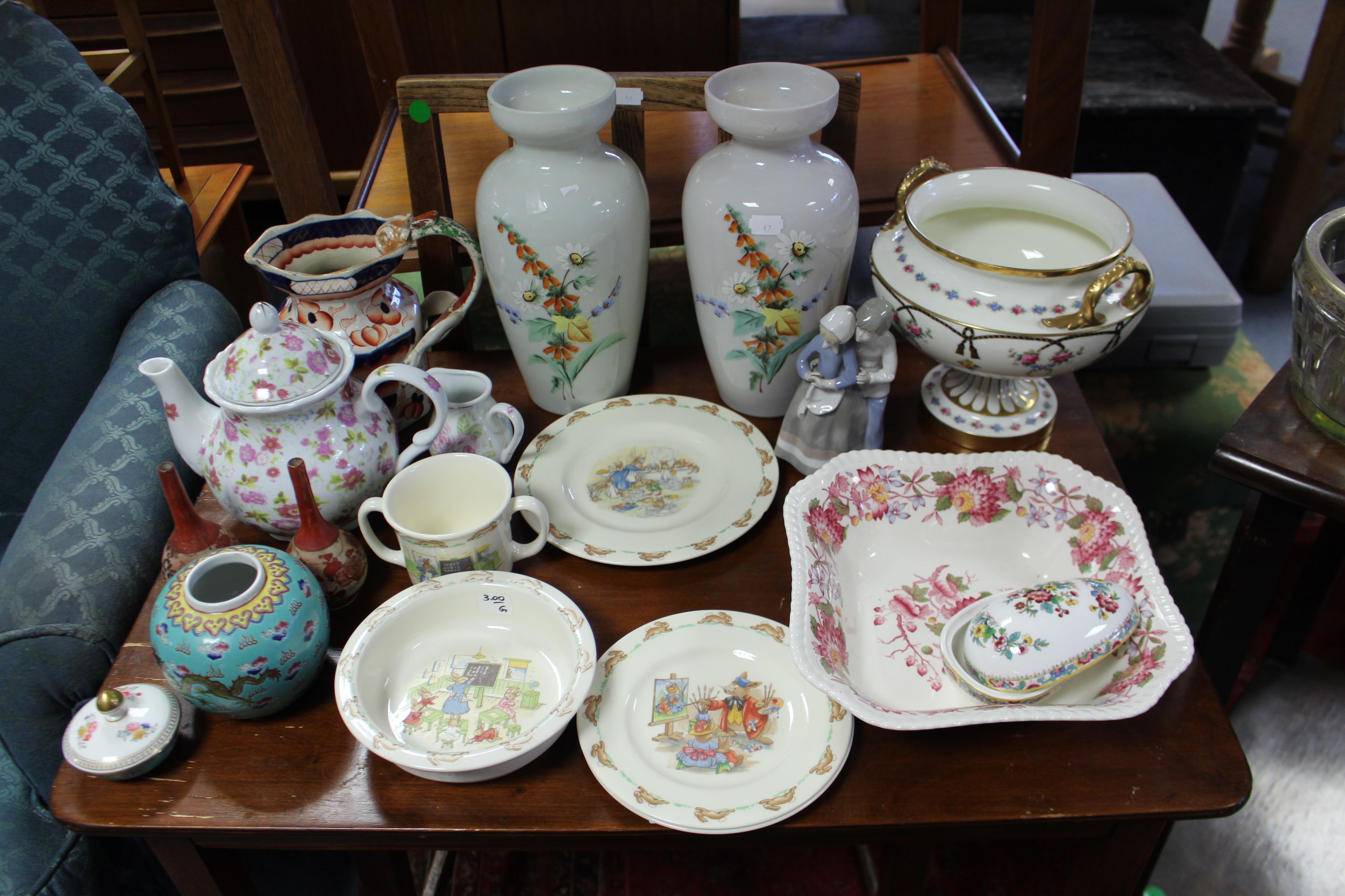 Two Victorian floral decorated opaque glass ovoid vases; five items of Royal Doulton Bunnykins ware;