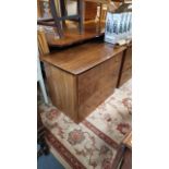 A pair of mahogany-finish bow-front small chests each fitted three long drawers, & on plinth base,
