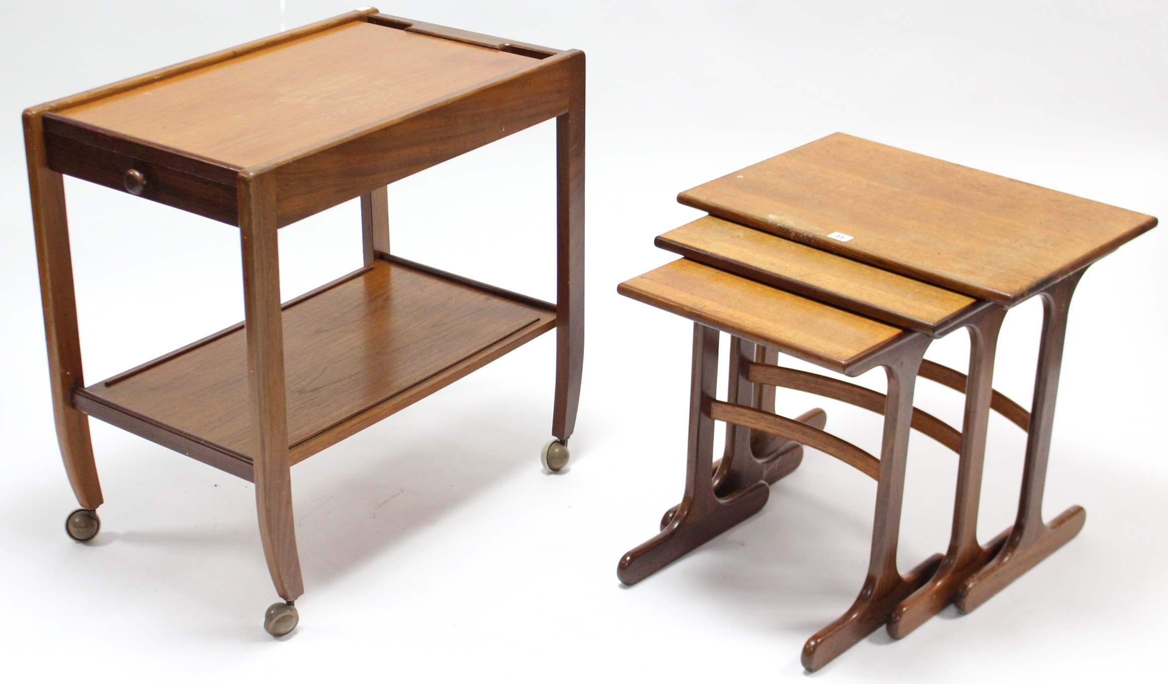 A teak nest of three rectangular occasional tables; & a teak rectangular two-tier tea trolley.