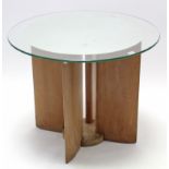 An Art Deco light oak occasional table with four shaped supports, on circular pedestal foot, &