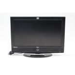 A Tevion LCD 31” television with remote control.