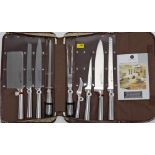 A Waltmann & Sons nine-piece kitchen knife set with case, - as new.