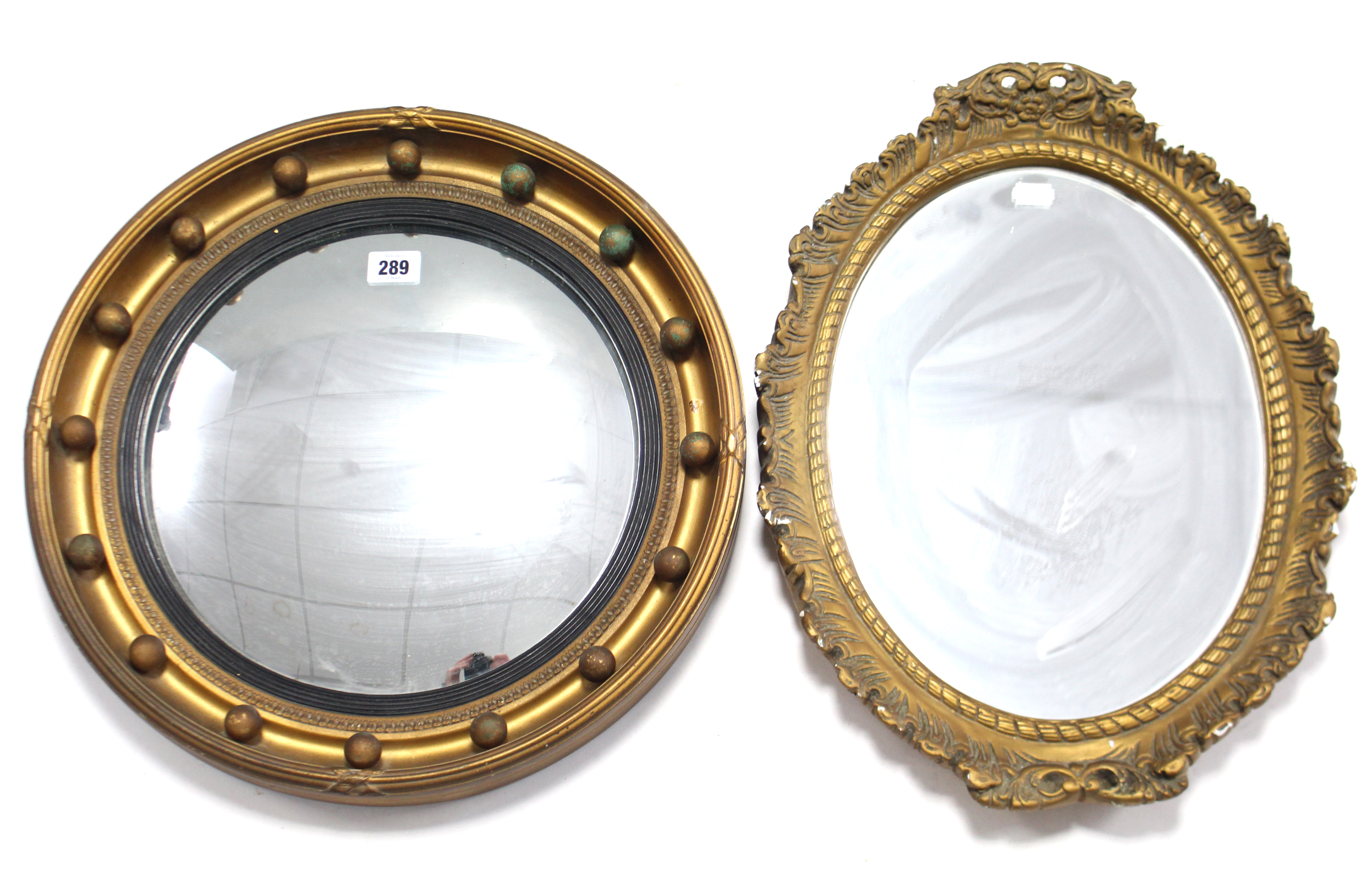 A regency-style gilt frame convex wall mirror with sphere border, 16¼” diam.; a gilt frame oval wall - Image 2 of 2