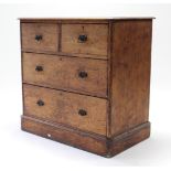 A Victorian pine dwarf chest, fitted two short & two long graduated drawers with iron swing handles,