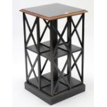 A 19th century-style ebonised & walnut-finish square three-tier revolving bookcase on plinth base,