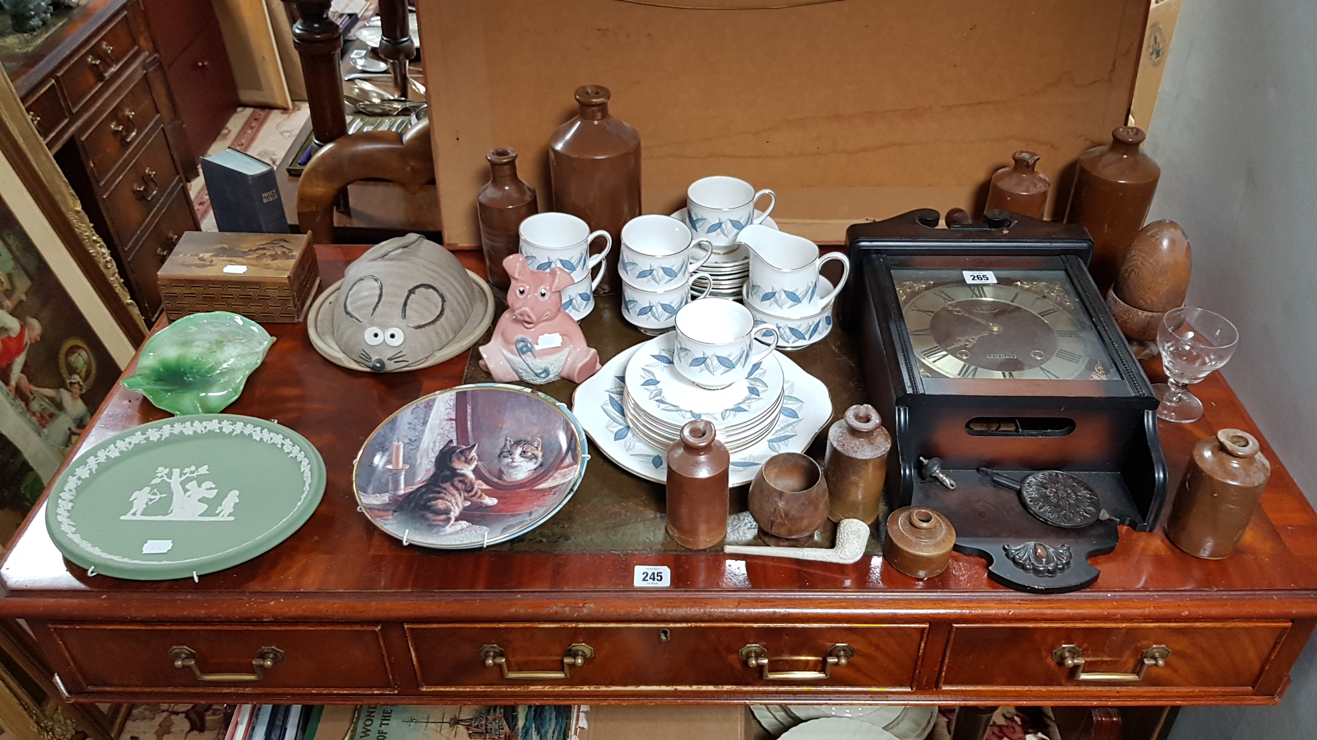 Five stoneware ink bottles, a modern wall clock, various books, etc.