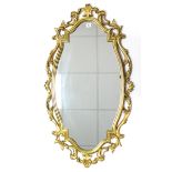 A 19th century-style gilt frame oval wall mirror, 40” x 23”.