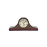 A mid-20th century mantel clock with silvered dial, chiming movement, & in mahogany domed-top