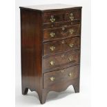 A Georgian-style walnut small serpentine-front chest, fitted two short drawers above brushing