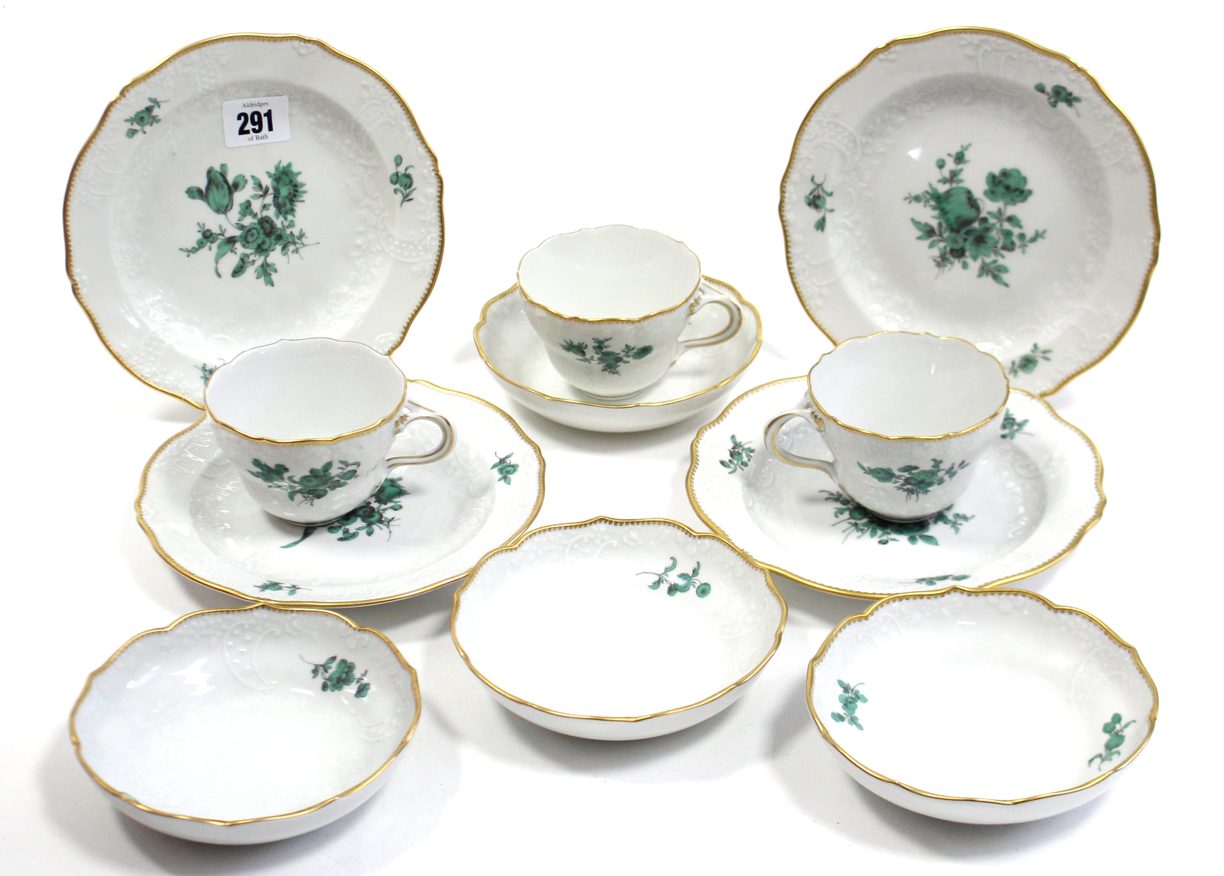 A Meissen porcelain twelve piece part tea service (settings for four), with green floral