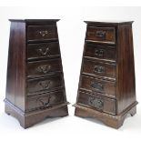 A pair of eastern-style hardwood chests, each of square tapered form, fitted six long graduated