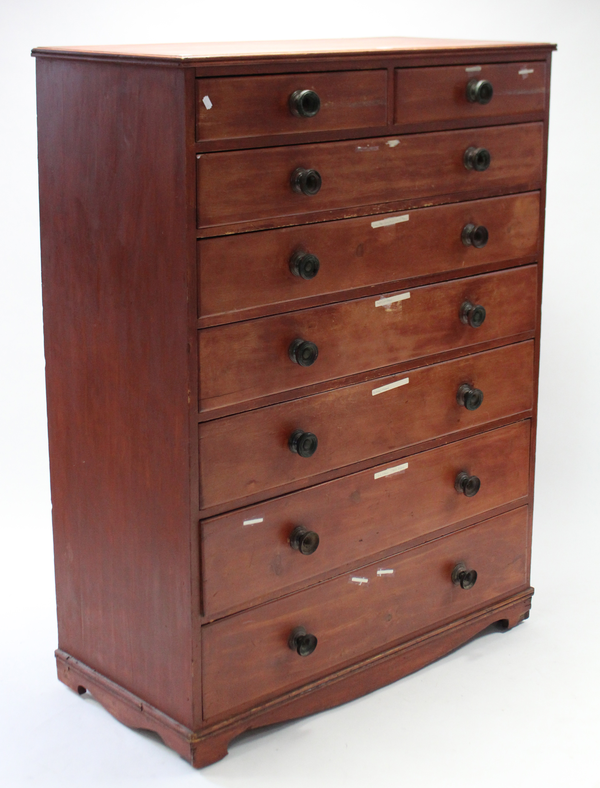 A Victorian stained pine tall chest, fitted two short & six long graduated drawers with turned