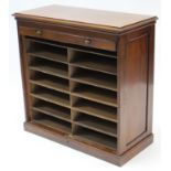 An Edwardian mahogany dwarf standing office cabinet, fitted two ranks of six pigeon holes enclosed