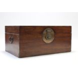 A Chinese camphor wood chest with hinged lift lid, & brass side handles, 37¼” wide x 37¾” high.