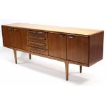 A mid-20th century Young’s teak sideboard fitted four long drawers to centre flanked by cupboard