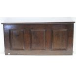 An antique panelled oak coffer lid, 47” wide.