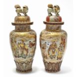 A pair of Satsuma pottery large ovoid vases, each with figure scene & floral panels