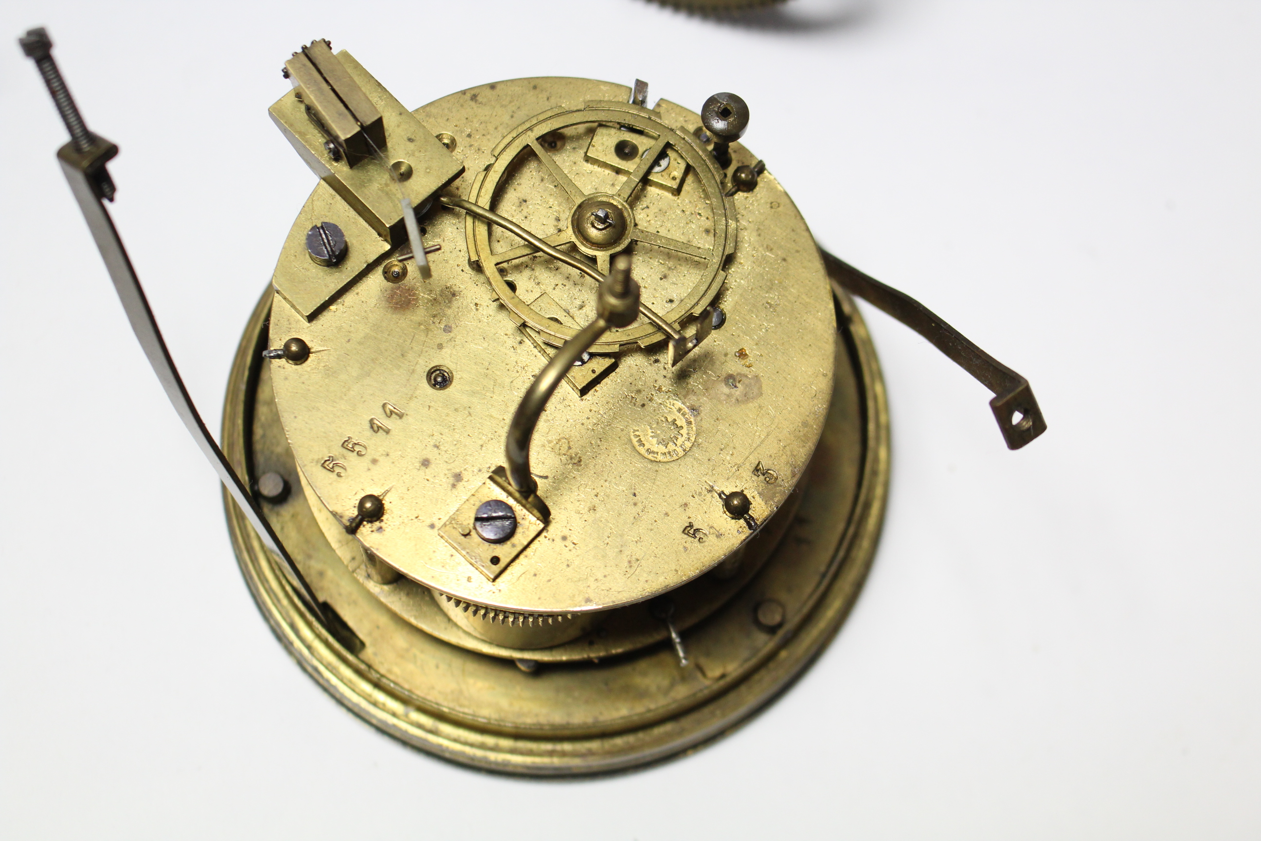 An early 20th century mantel clock mechanism with white enamel dial, 4¼” diam.; & various clock - Image 3 of 4