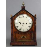 A Regency bracket clock in mahogany & brass-inlaid steeple case, the 7” painted convex dial with