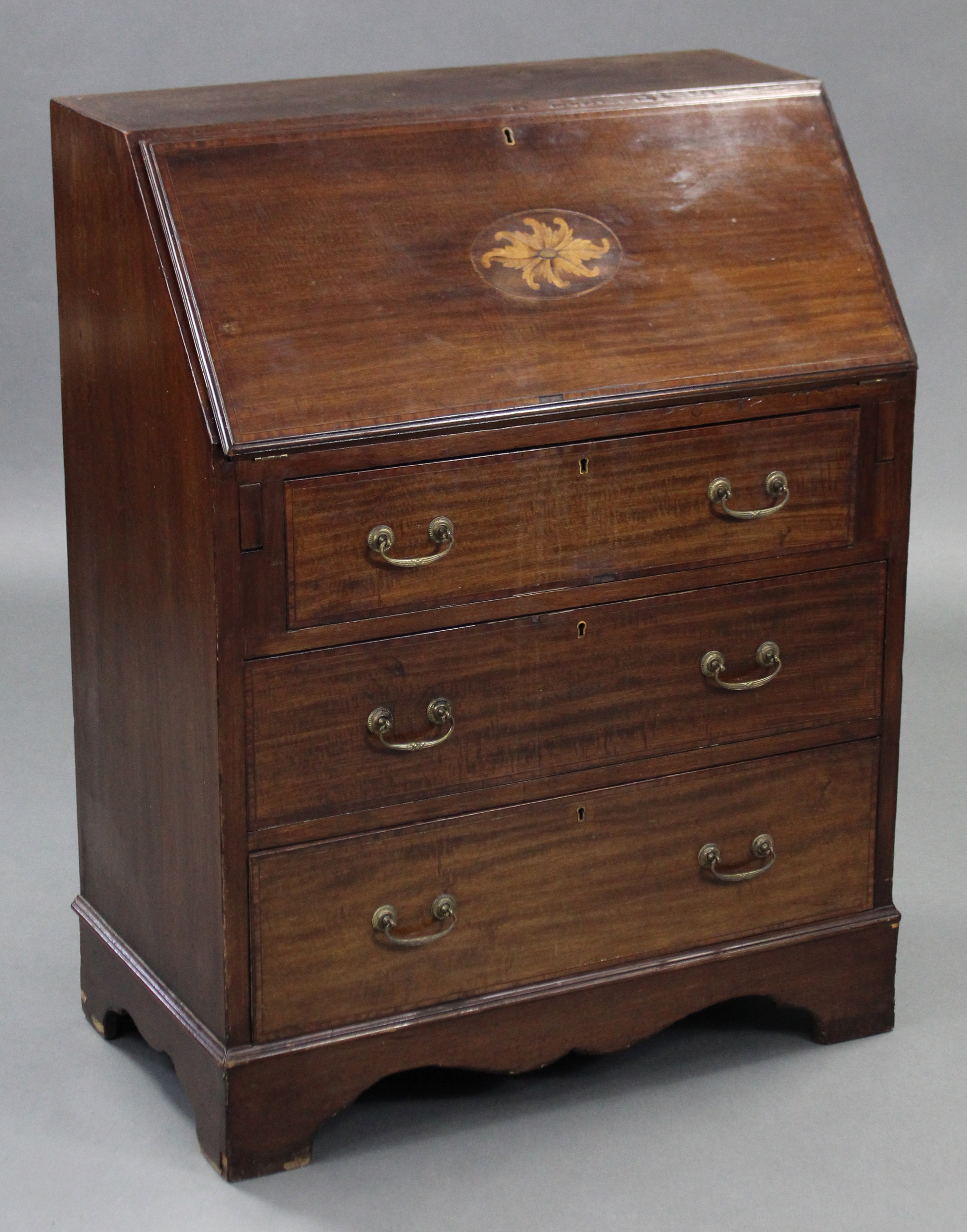 An Edwardian inlaid-mahogany small bureau, the sloping fall-front enclosing tooled leather writing