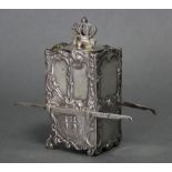 A continental silver tea caddy in the form of a sedan chair, with all-over embossed decoration, a