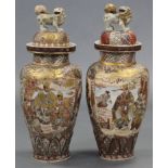 A pair of late 19th century Japanese Satsuma pottery large ovoid vases with figure decoration &
