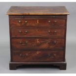 A LATE 18th century FIGURED MAHOGANY CHEST with moulded edge, fitted brushing slide above four