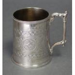 A Victorian silver round tapered mug with cast gothic leaf-scroll handle, beaded rims, & engraved
