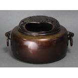 A Chinese bronze large censer of squat circular form, with foliate & ring side handles, &