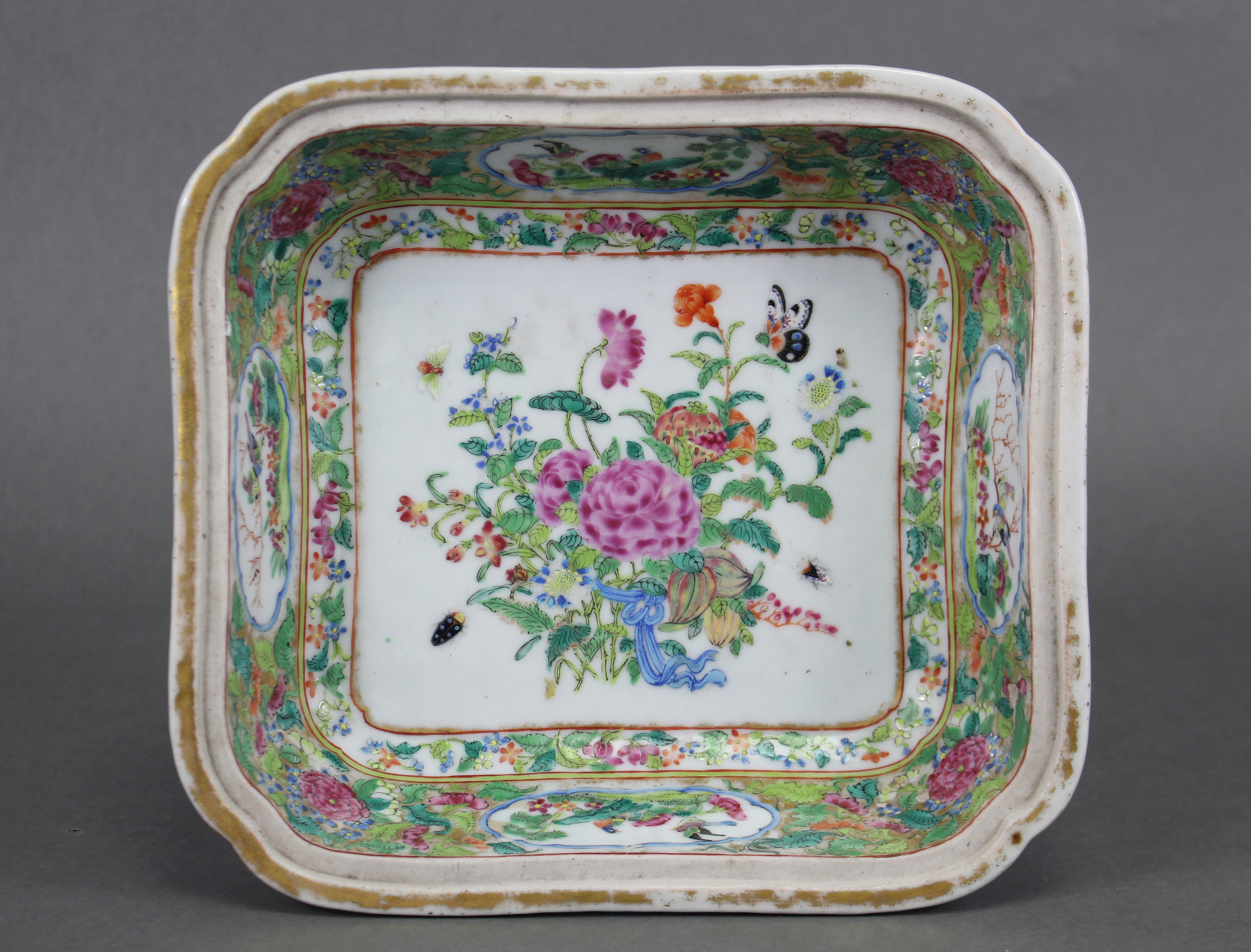 A 19th century Cantonese porcelain square dish decorated in famille rose enamels with a bouquet of