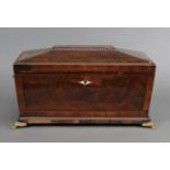 A George III figured mahogany two-division tea caddy of sarcophagus form, with boxwood & ebonised