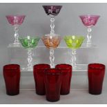 A Harlequin set of six wine glasses, the wide bowls overlaid in different colours & with cut