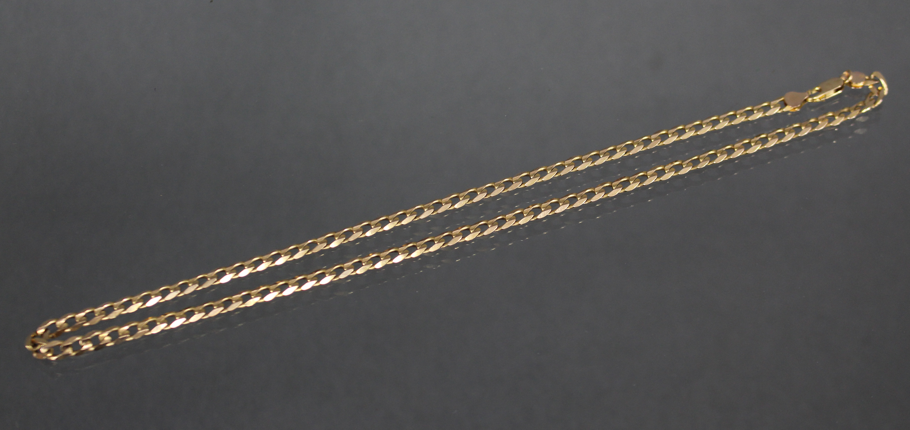 A 9ct. gold necklace of flattened curb links. (21.5gm). - Image 2 of 3