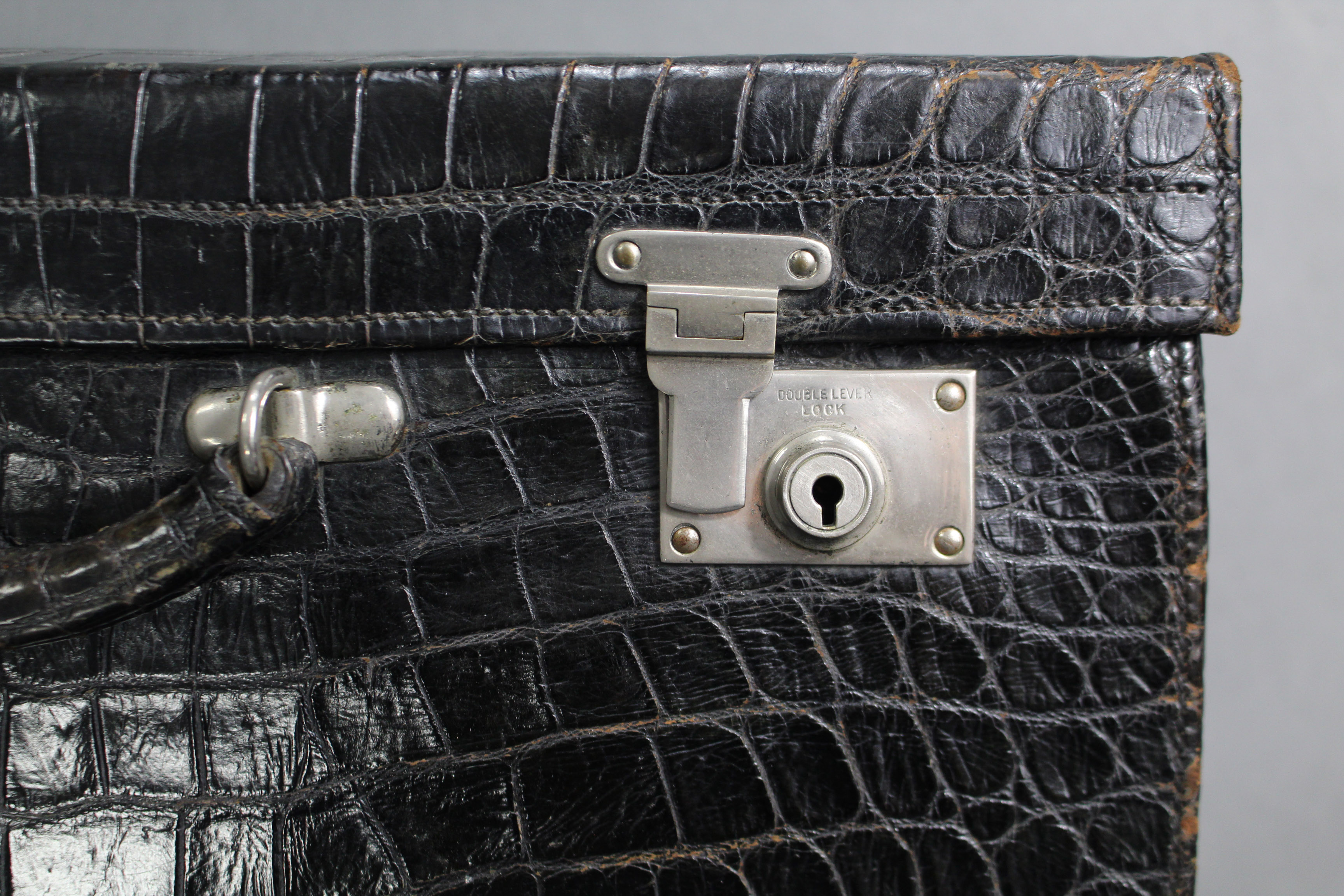 A black crocodile skin suitcase with green moiré silk lining, & silvered twin locks. - Image 2 of 3