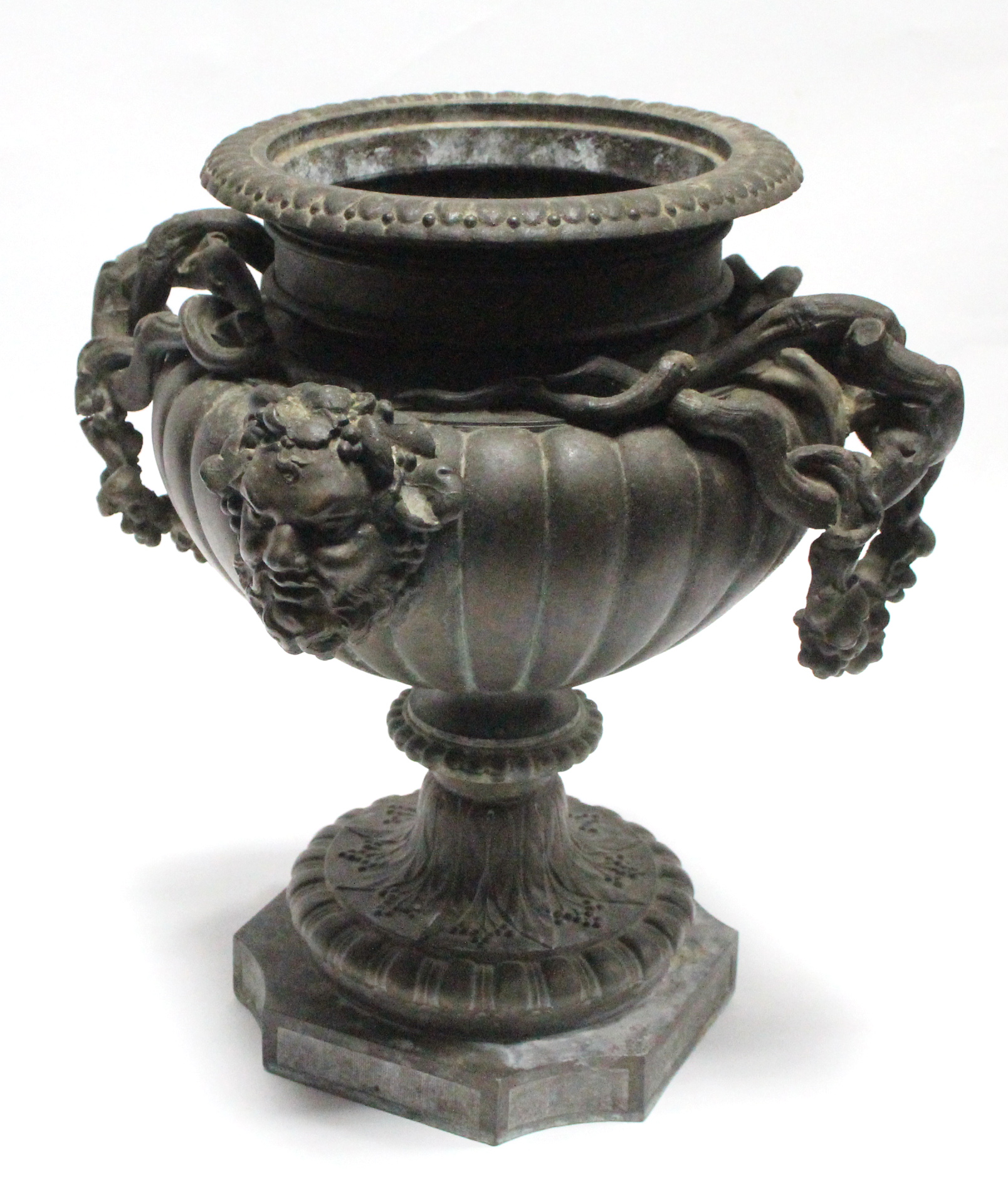 A 19th century bronze urn of fluted ovoid form, with grapevine side handles & Bacchus masks, on - Image 2 of 3