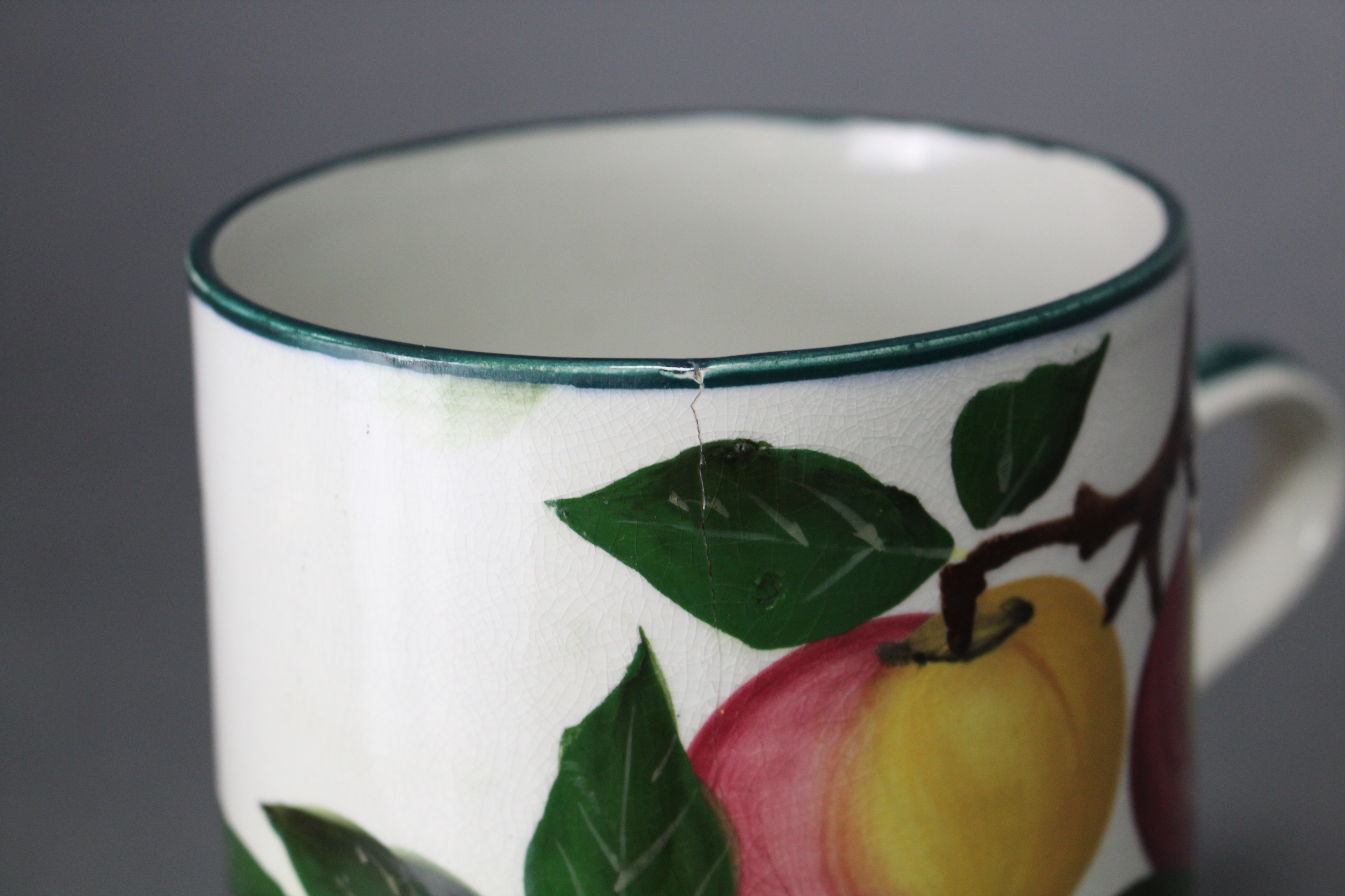 A Wemyss Ware (R. Heron & Son) pottery large cylindrical mug painted with the “Apples” pattern; - Image 6 of 8