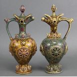 A pair of Zsolnay pottery ewers with raised bodies & narrow necks, applied pierced wheel & boss
