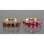 A 9ct. gold ring set five graduated oval rubies; size: P; weight: 2.6gm; & a 9ct. gold ring set four