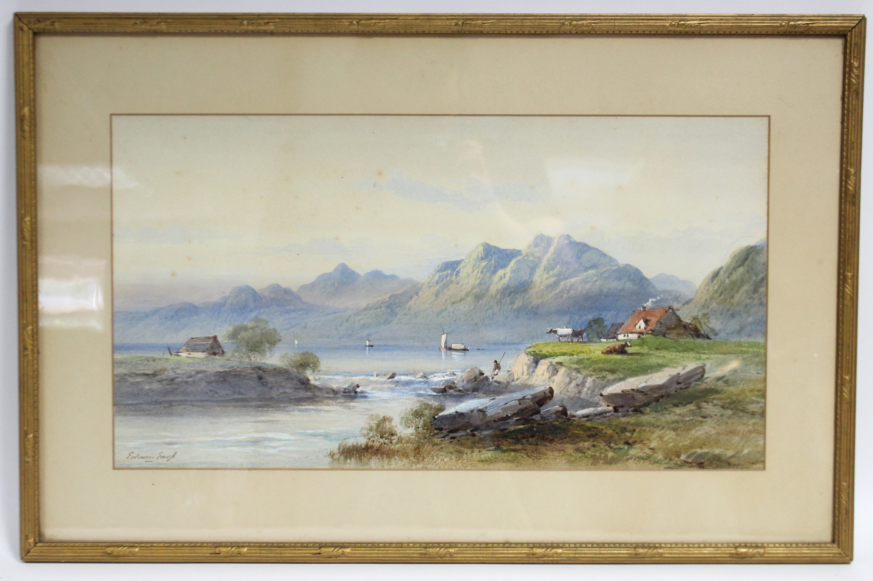 EDWIN EARP (1851-1945). A mountainous landscape with figures, cattle & buildings beside a lake.