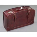 A Chinese “Rhinocerous” brand brown leather large suitcase by the Fook Seng Company.