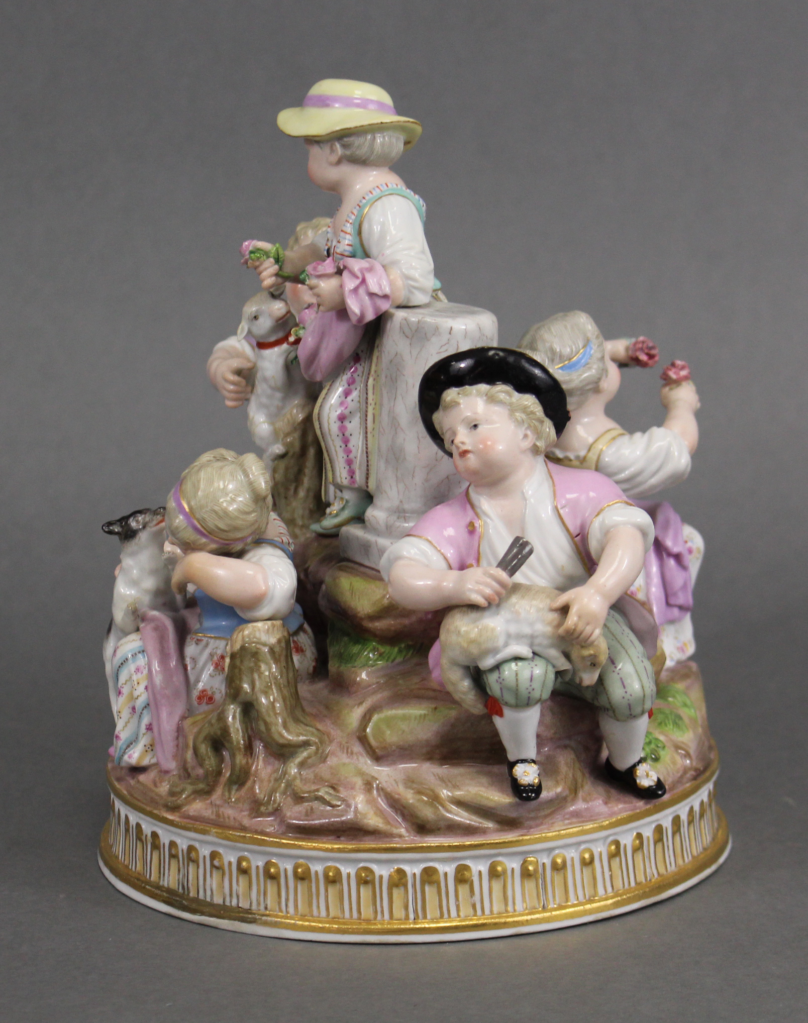 A MEISSEN PASTORAL GROUP of three female & two male figures about a central truncated column, one - Image 4 of 5