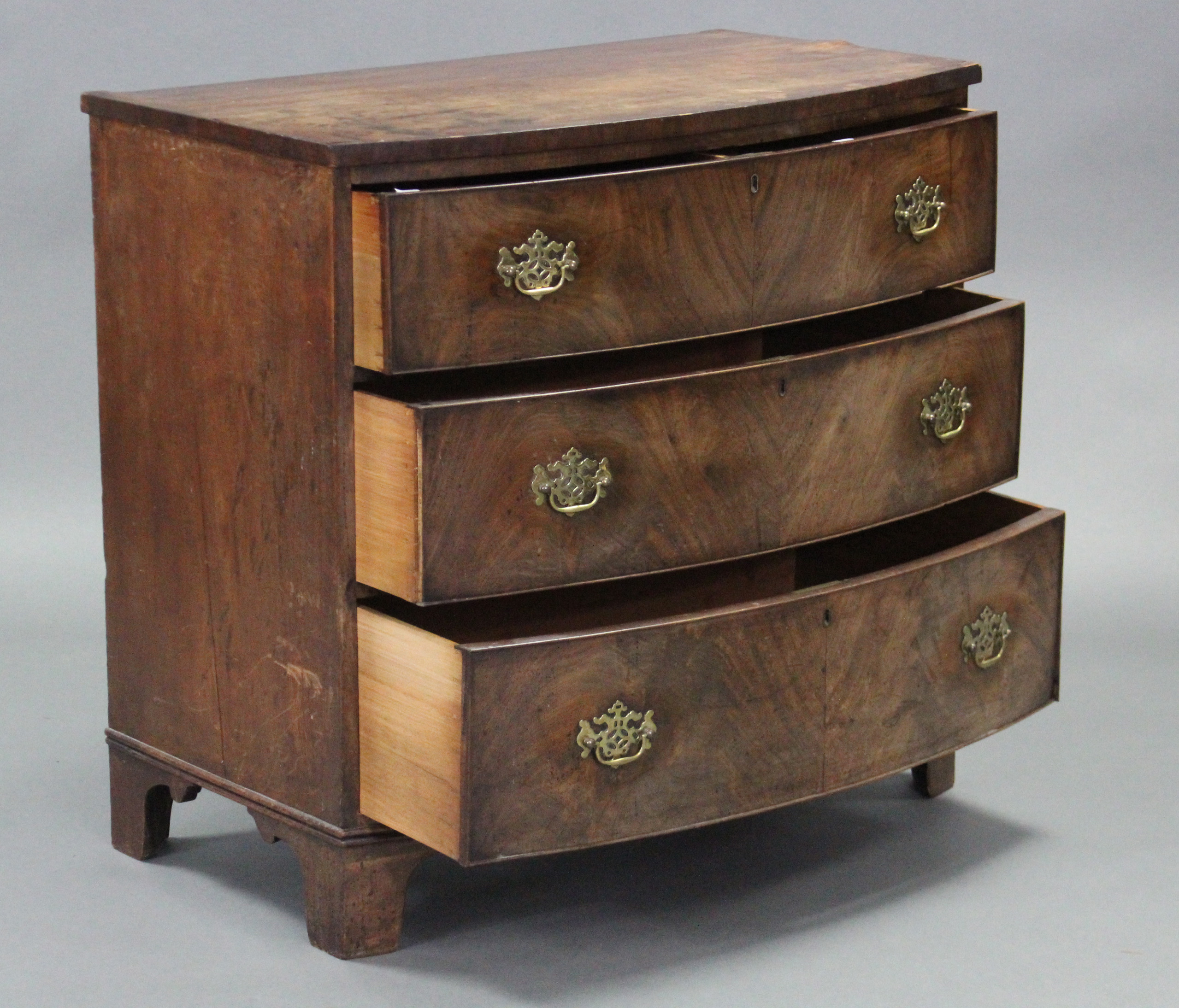 An early 19th century figured mahogany bow-front chest fitted three long graduated drawers with - Image 2 of 3