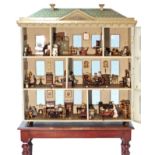 A FINE VICTORIAN LARGE DOLL’S HOUSE WITH EXTENSIVE ORIGINAL FURNISHINGS, circa 1876, the double-