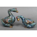 A PAIR OF CHINESE CLOISONNE BOXES IN THE FORM OF GEESE, each in different pose, the wings forming