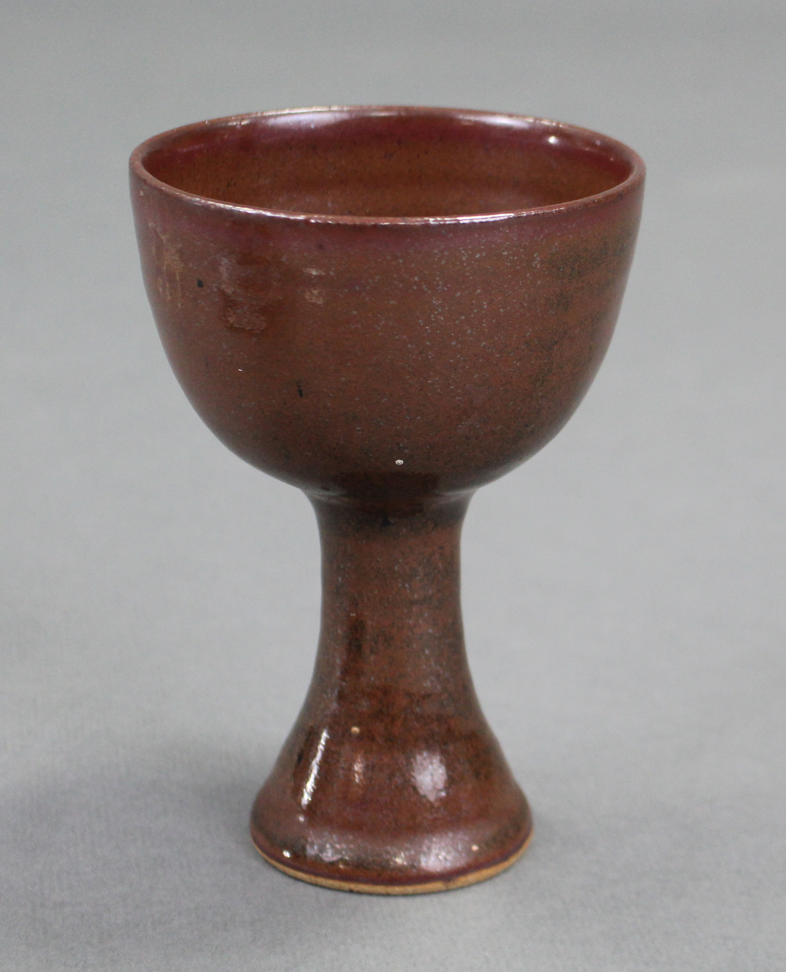 A Chinese brown-glazed stoneware stem cup; 4” diam. x 5½” high.