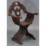 A late 19th/early 20th century carved walnut & mother-of-pearl inlaid Savonarola chair, with pierced