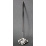 A George III silver punch ladle, the single-lipped oval bowl inset George II 1758 shilling, & with