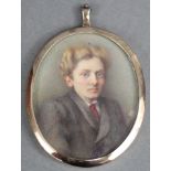 An Edwardian portrait miniature of a young man, 2½” x 2” (oval), in silver frame with London